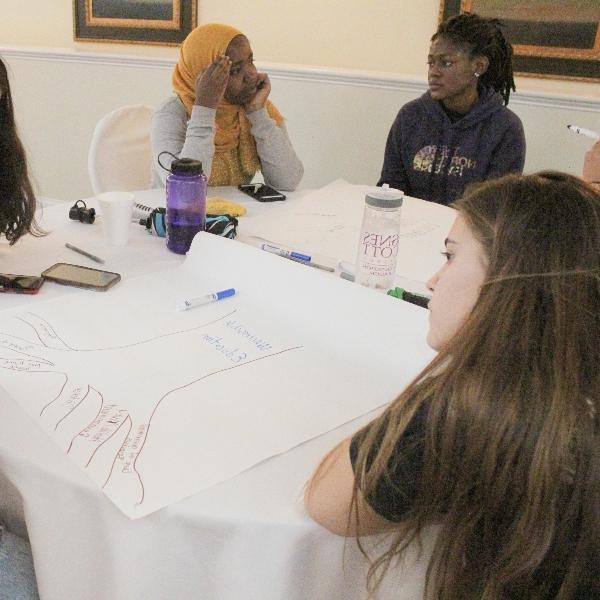 students sit at a table